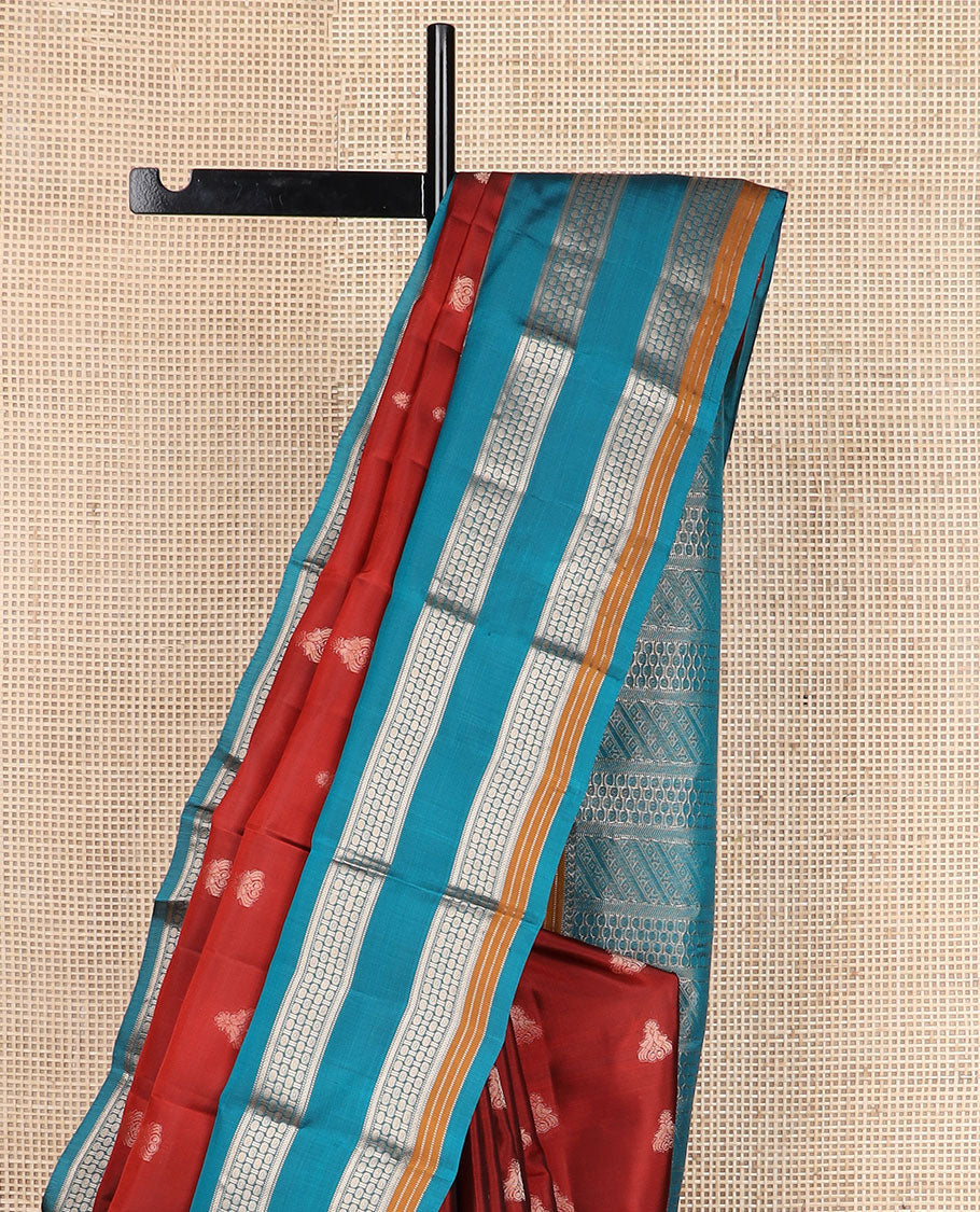 Rust zari buttas silk saree, contrast border of manga mokku,muthu,kathir & rudraksham motifs & geometric patterned pallu