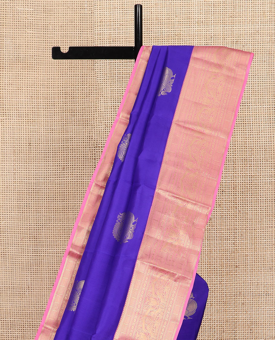 Blue Vasundhara Silk Saree Prettified with Mayil Buttas, Complemented by a Contrast Border of Thilakam, Kathir, Kuyil Kann, Laddu Kamalam, Iru Thalai Pakshi, and Yaali Designs, Pallu Adorned with Geometric Designs, and Paired with a Contrast Blouse