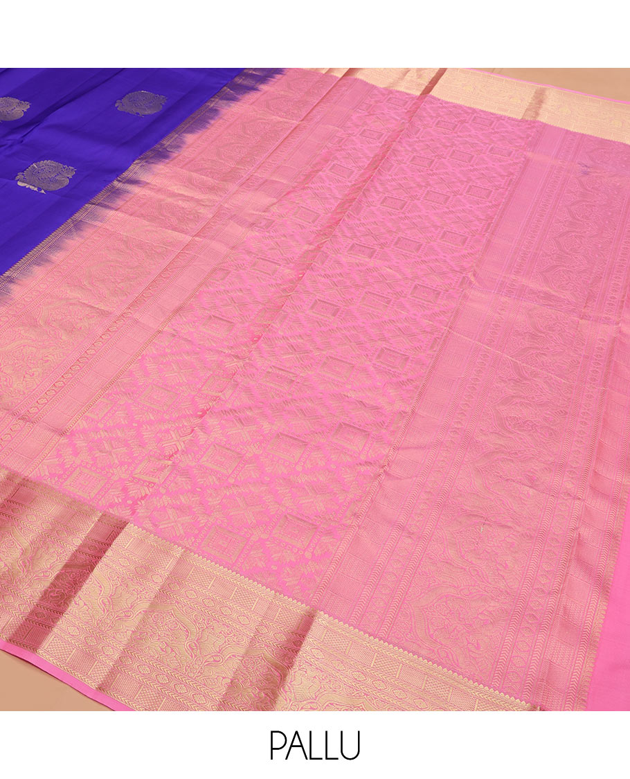 Blue Vasundhara Silk Saree Prettified with Mayil Buttas, Complemented by a Contrast Border of Thilakam, Kathir, Kuyil Kann, Laddu Kamalam, Iru Thalai Pakshi, and Yaali Designs, Pallu Adorned with Geometric Designs, and Paired with a Contrast Blouse