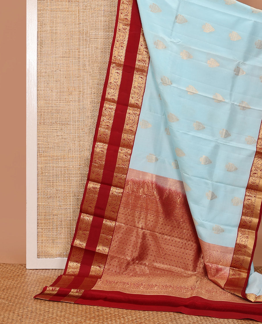 Baby blue zari buttas silksaree, contrast jaal pallu & rettai pettu border features annam,mayil & yaanai designs