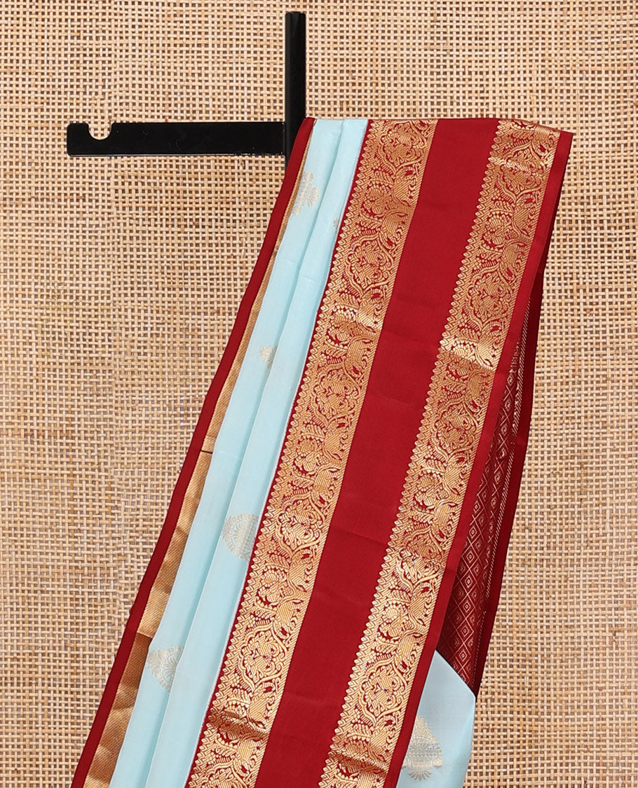 Baby blue zari buttas silksaree, contrast jaal pallu & rettai pettu border features annam,mayil & yaanai designs