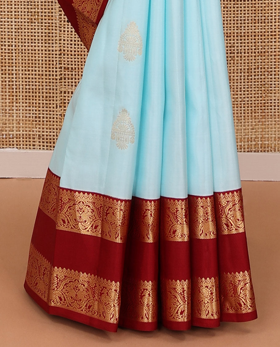 Baby blue zari buttas silksaree, contrast jaal pallu & rettai pettu border features annam,mayil & yaanai designs