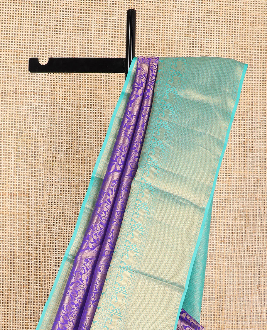 Purple jaal design kancheepuram silk saree with contrast border of rekku, muthu, poo chakram mayil design & zari design pallu