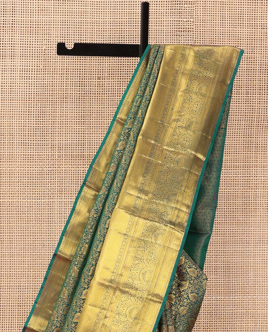 Green floral jacquard wedding silk saree, traditional zari border of thilakam mokku, kamalam, and mayil kann, and jaal pallu
