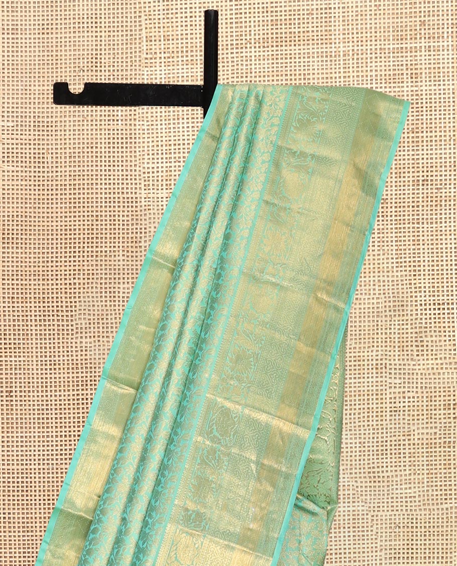 Turquoise Kanchipuram Wedding Silk Saree, Decorated with Jacquard Design, a Traditional Zari Border, Grand Pallu, and a Matching Blouse