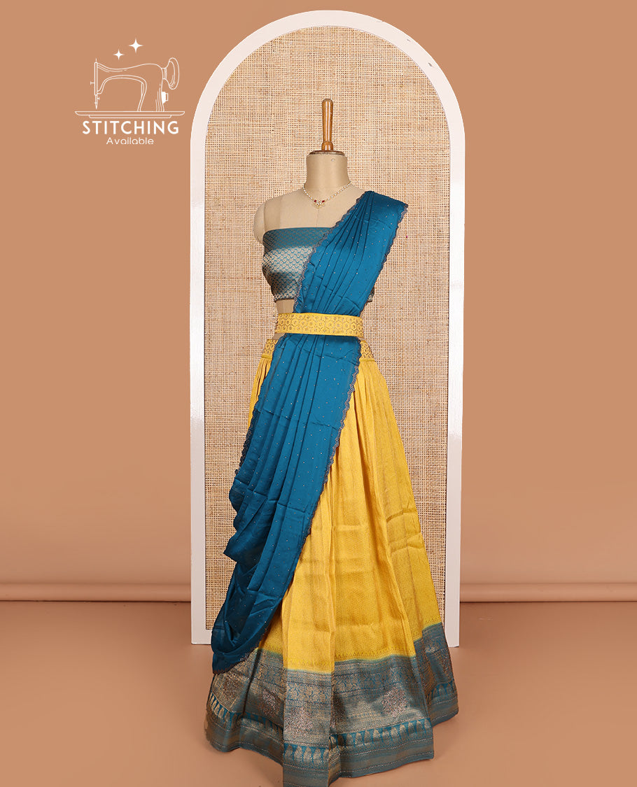 Yellow art silk half-saree, brocade with contrast traditional border skirt, contrast brocade blouse, scallop stone work dhavani, and and detachable belt