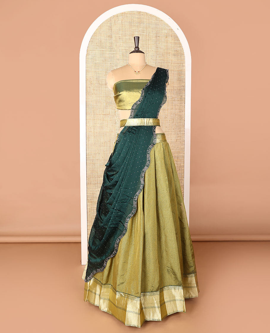 Green art-silk half-saree, plain with contrast bordered skirt, contrast blouse, and a scallop stone work dhavani