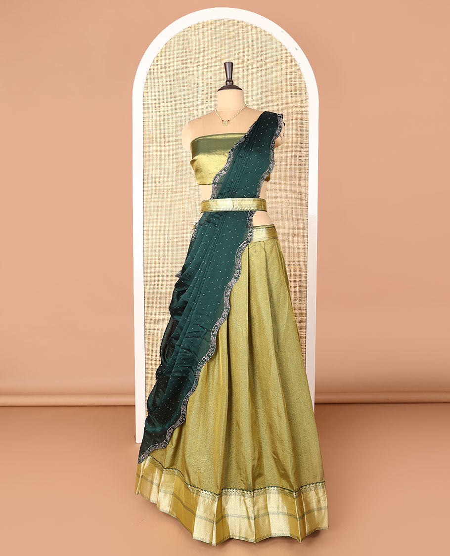 Green art-silk half-saree, plain with contrast bordered skirt, contrast blouse, and a scallop stone work dhavani