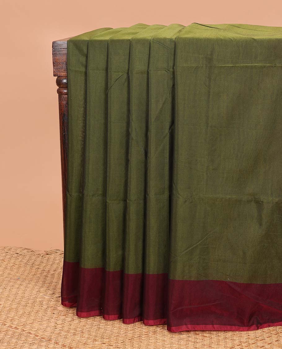 Green plain semi-silk cotton saree, contrast plain border, and pallu