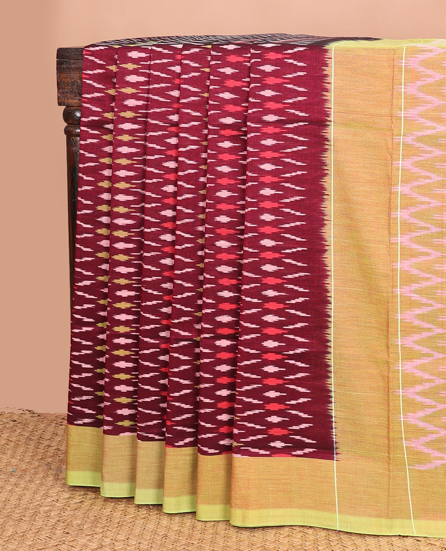 Maroon unique buttas woven ikkat cotton saree, contrast plain border, and pallu of chevron stripes