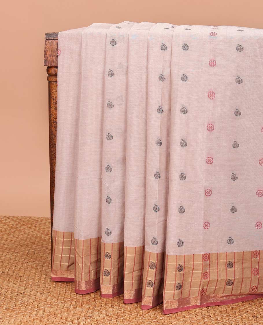 Pastel pink chakra, and paisley buttas Coimbatore cotton saree, contrast butta enclosed checked border, and pallu of paisleys and chevron design