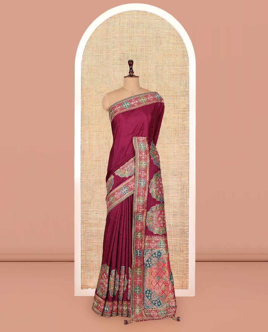 Wine Dola Silk Saree, Embellished with Rangoli-Style Colorful Embroidery on Its Body, Highlighted by an Embroidered Border, Pallu of Embroidery and Print Work, and Paired with a Matching Blouse