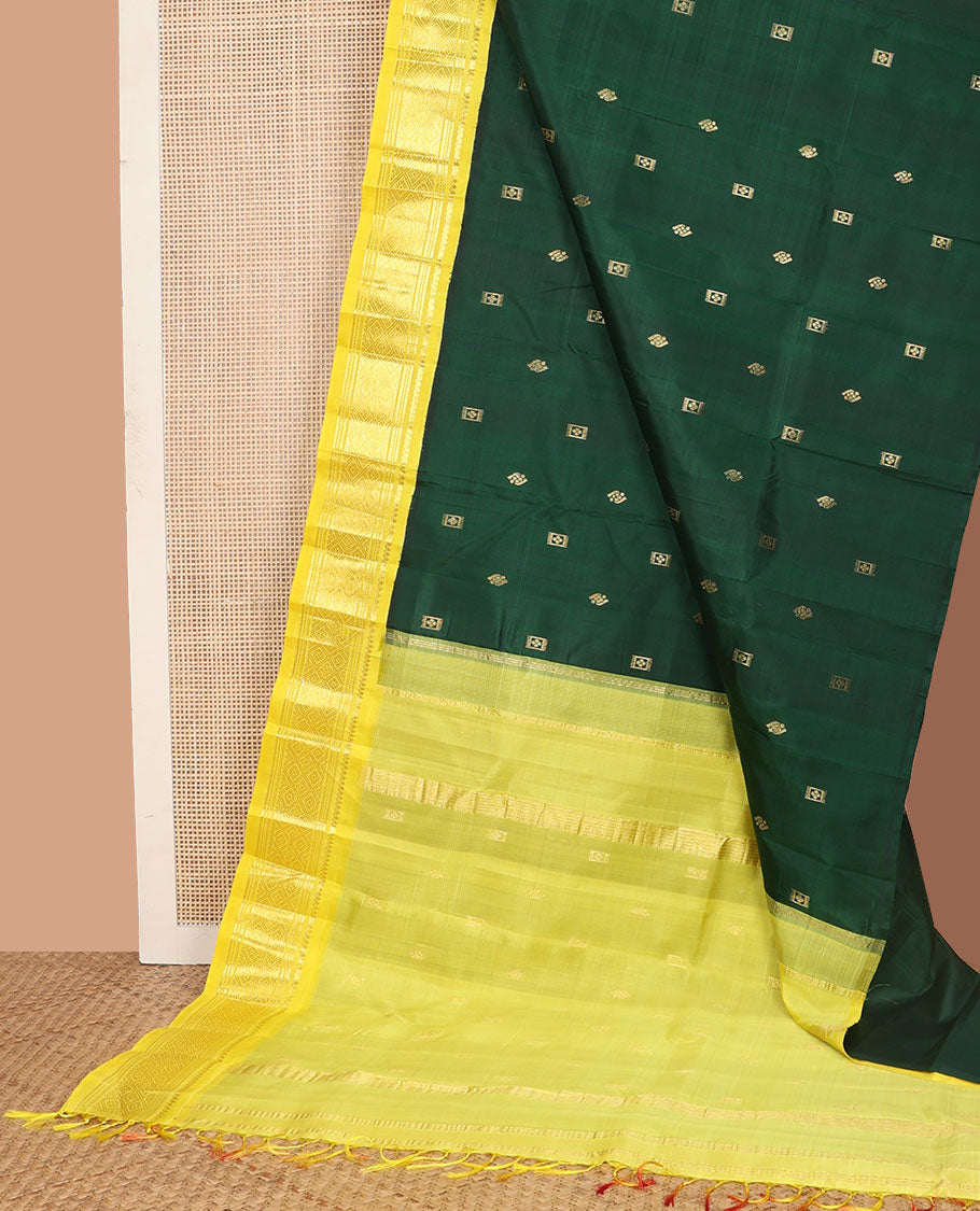 Green zari buttas Kanchipuram silk saree, contrast one-sided korvai border of thilakam mokku, banaras, muthu, and jaal designs, and zari design pallu