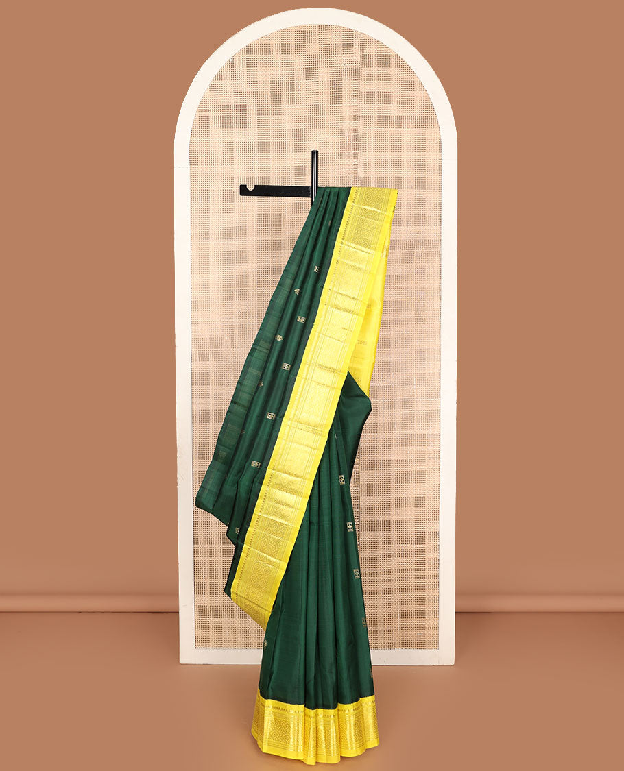 Green zari buttas Kanchipuram silk saree, contrast one-sided korvai border of thilakam mokku, banaras, muthu, and jaal designs, and zari design pallu