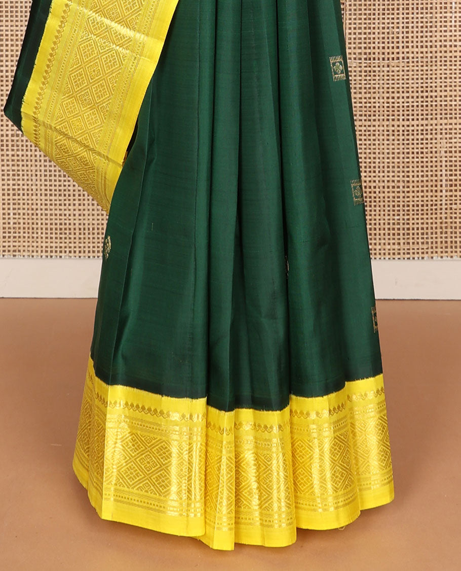 Green zari buttas Kanchipuram silk saree, contrast one-sided korvai border of thilakam mokku, banaras, muthu, and jaal designs, and zari design pallu