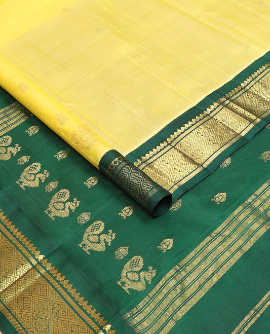 Yellow zari buttas kanchipuram silksaree, contrast one-sided korvai border of salngai & jaal design & mayil design pallu