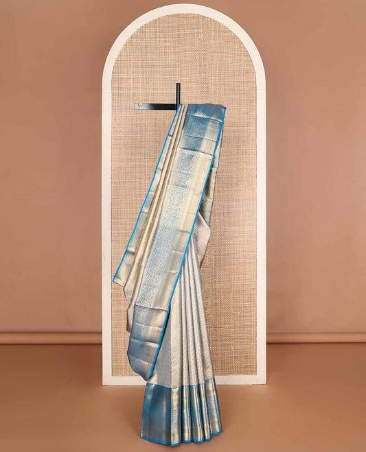 Blue jacquard tissue silk saree, self-pallu of jaal & mayil chakram & zari border of thilakam mokku, neli kathir, jaal & chakram designs