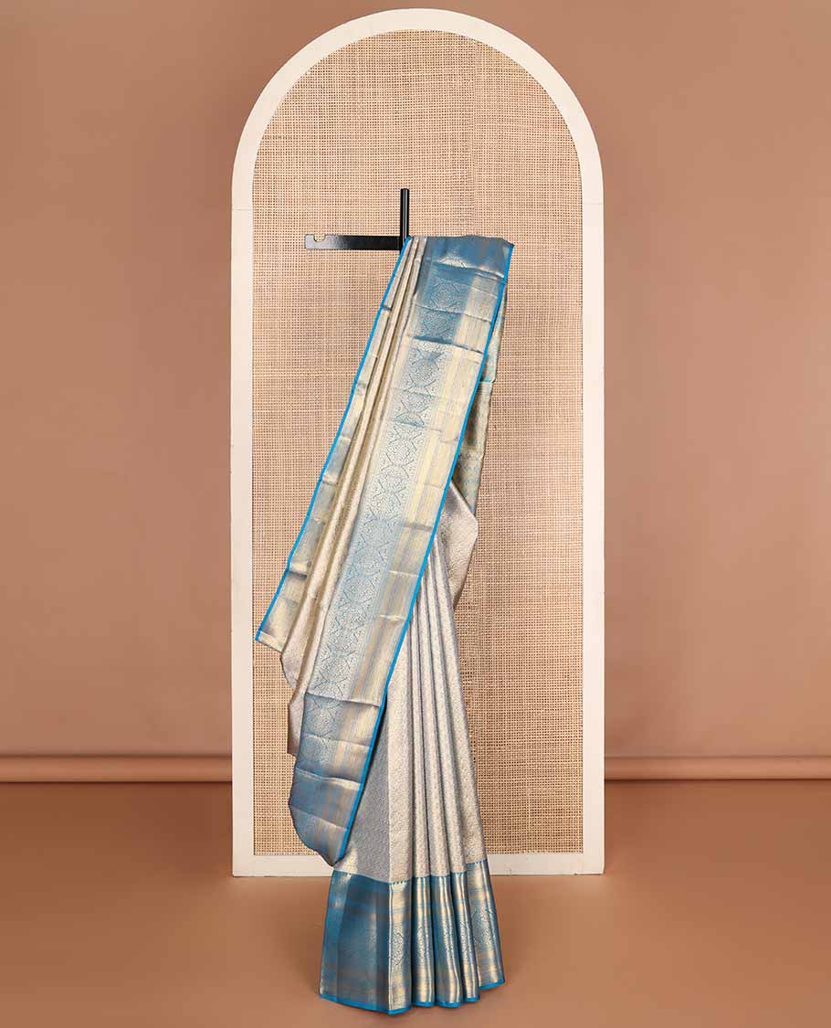 Blue jacquard tissue silk saree, self-pallu of jaal & mayil chakram & zari border of thilakam mokku, neli kathir, jaal & chakram designs