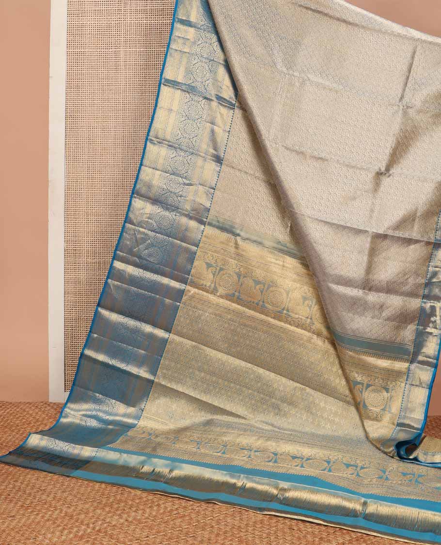 Blue jacquard tissue silk saree, self-pallu of jaal & mayil chakram & zari border of thilakam mokku, neli kathir, jaal & chakram designs