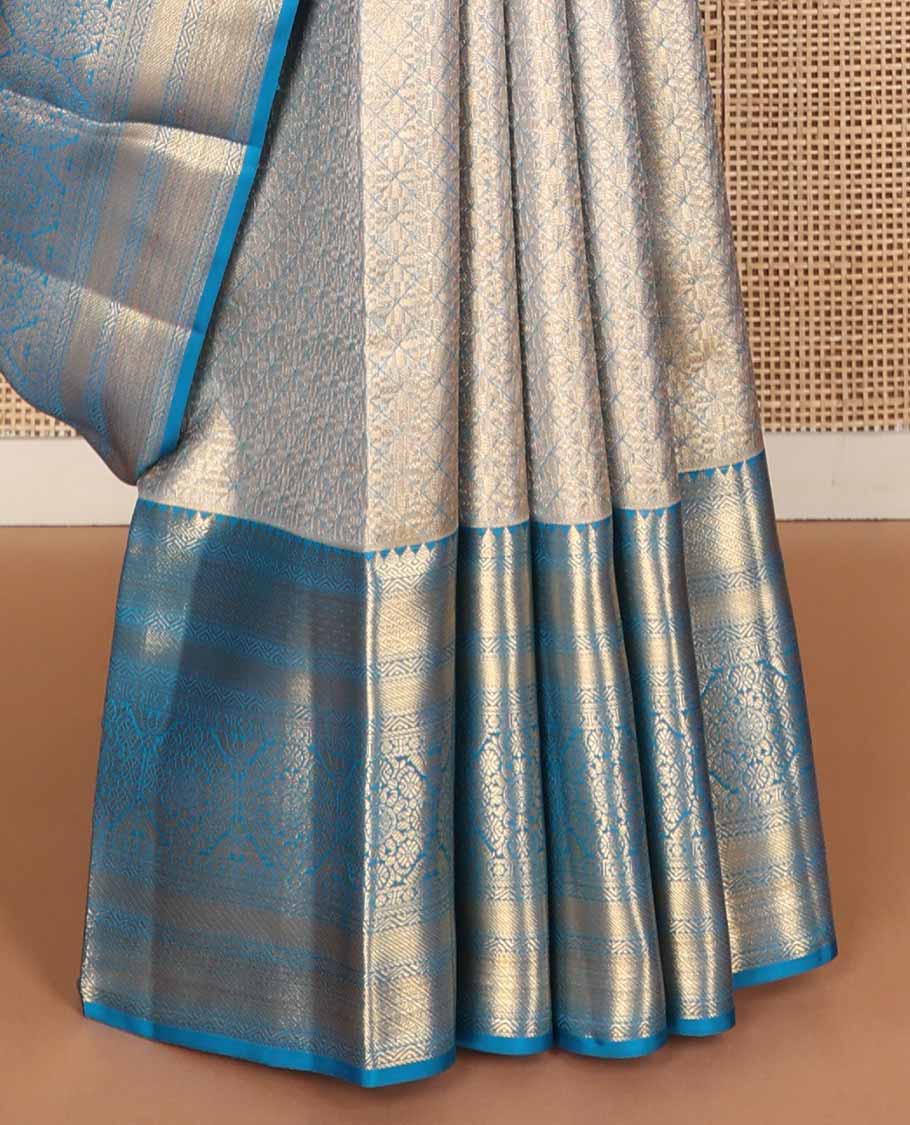 Blue jacquard tissue silk saree, self-pallu of jaal & mayil chakram & zari border of thilakam mokku, neli kathir, jaal & chakram designs