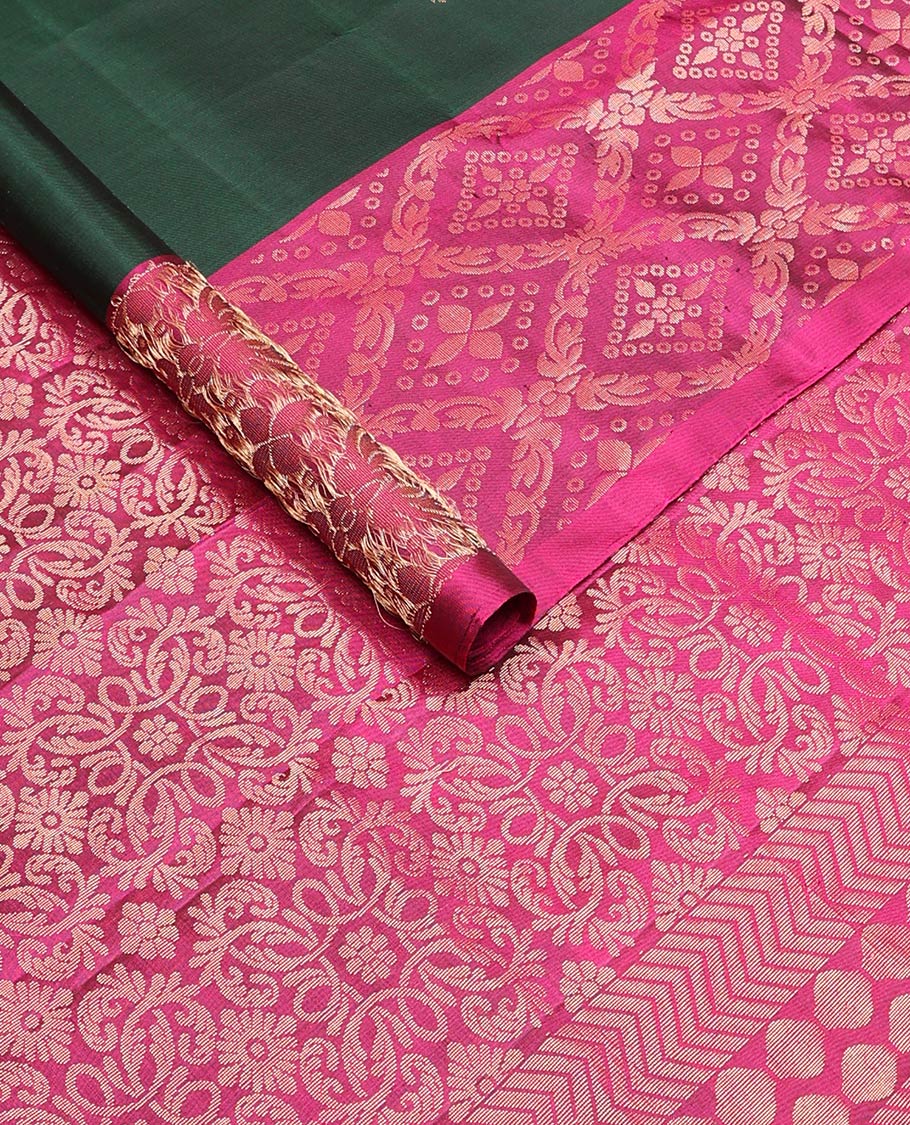 Deep green zari buttas soft silk saree, contrast jaal patterned border, and pallu of intricate design