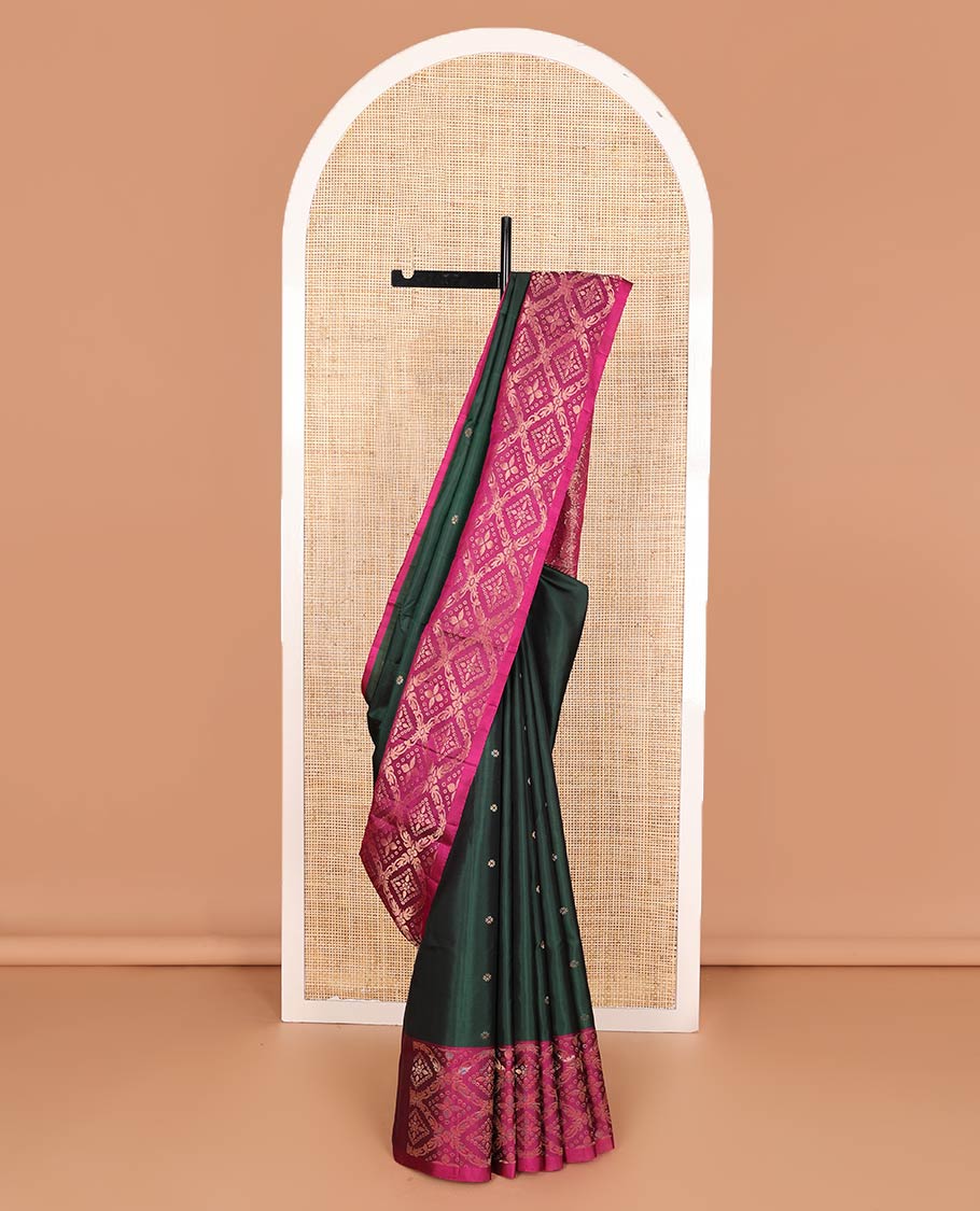 Deep green zari buttas soft silk saree, contrast jaal patterned border, and pallu of intricate design