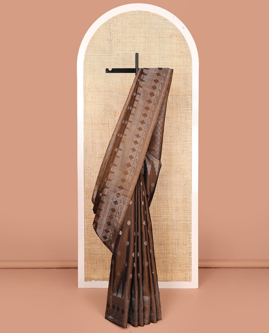 Brown rudraksham buttas soft silk saree, temple geometric patterned border of muniya designs, and intricate pallu