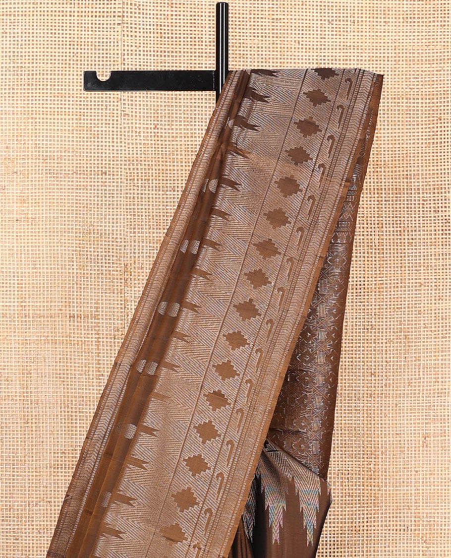Brown rudraksham buttas soft silk saree, temple geometric patterned border of muniya designs, and intricate pallu