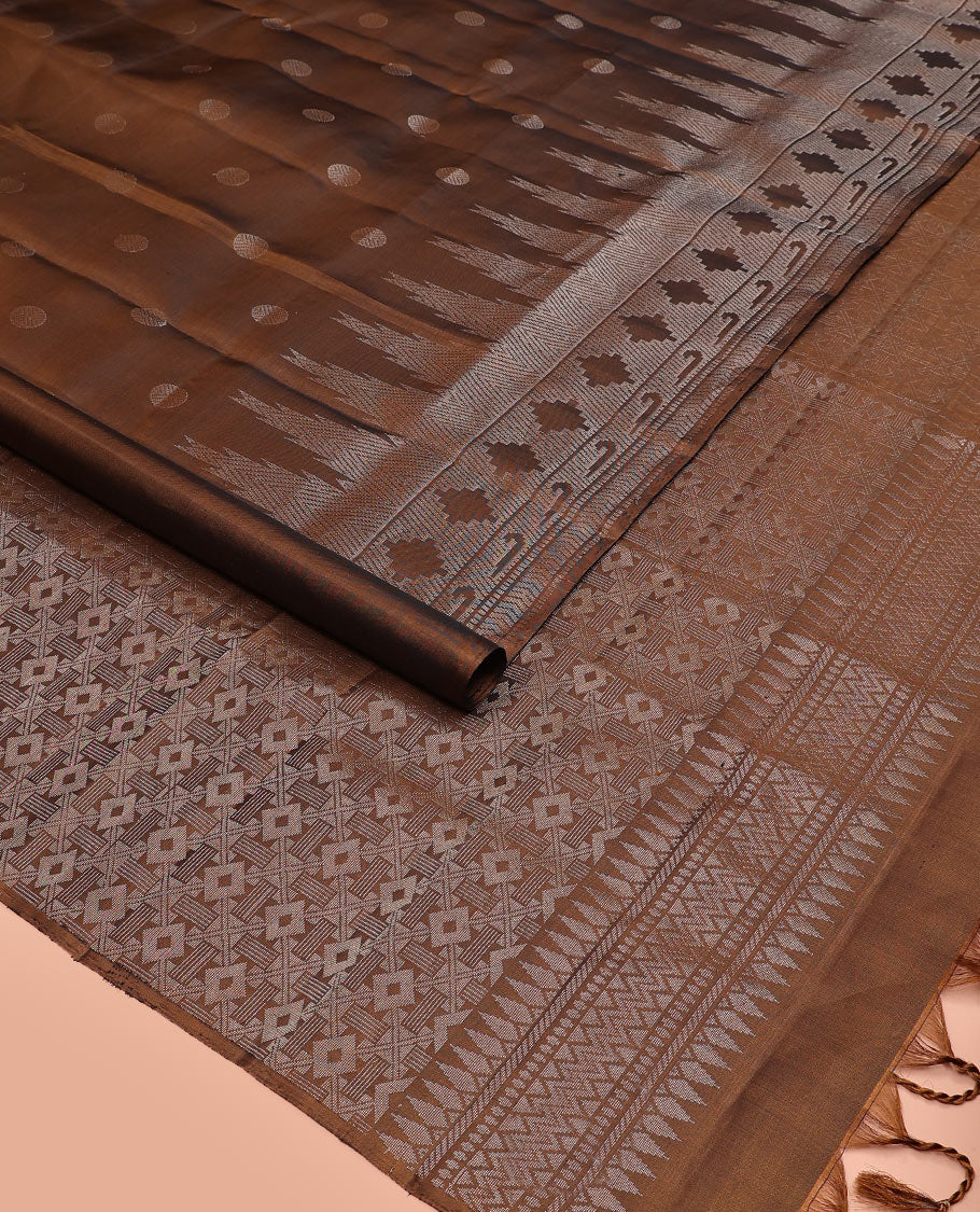 Brown rudraksham buttas soft silk saree, temple geometric patterned border of muniya designs, and intricate pallu