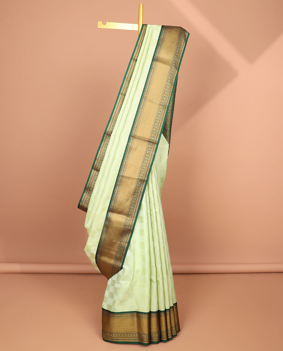 Mint green checked soft silk saree with contrast intricate zari design & argyle design pallu