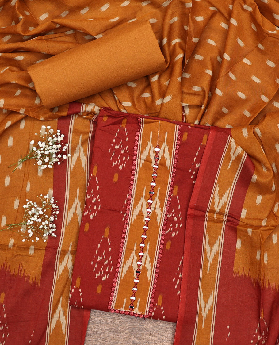 Rust Cotton Material Chudidar Set, Subtly Sparkled with Ikkat-Style Buttas on Its Top, a Plain Cotton Bottom, and Paired with a Cotton Ikkat Woven Dupatta