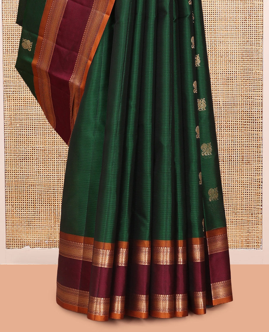 Green Vasundhara Lite Silk Mix Saree Features Mayil Buttas and Stripes, a Contrast Rettai Pettu Border of Salngai, Banaras, Neli, Kuyil, Kann, and Vanki Designs, Mayil Kann Pallu, and a Contrast Blouse