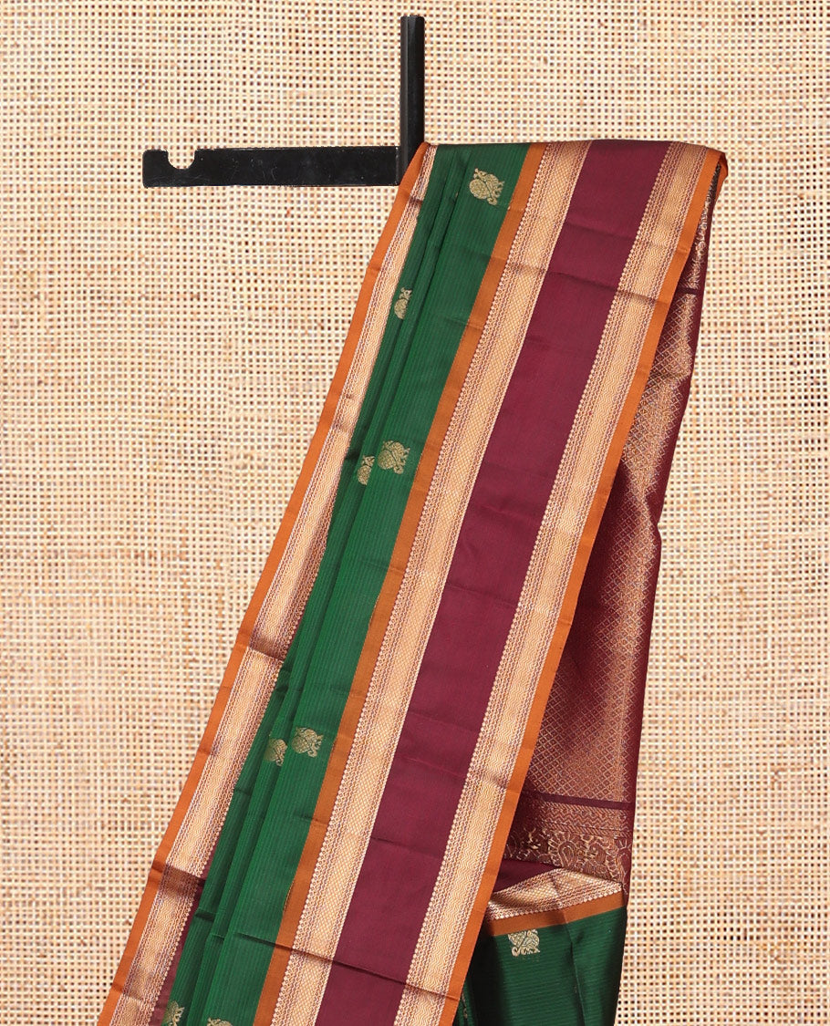 Green Vasundhara Lite Silk Mix Saree Features Mayil Buttas and Stripes, a Contrast Rettai Pettu Border of Salngai, Banaras, Neli, Kuyil, Kann, and Vanki Designs, Mayil Kann Pallu, and a Contrast Blouse