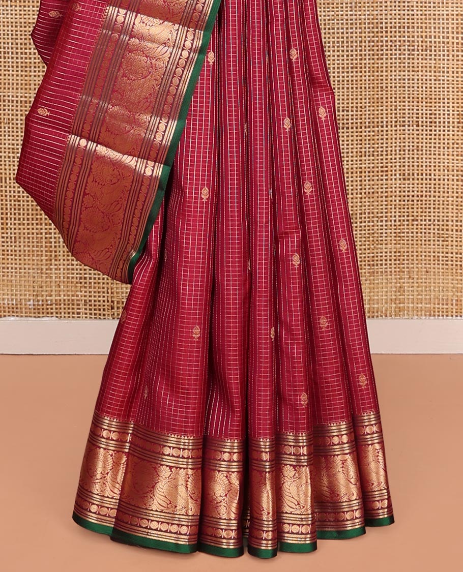 Reddish Pink Vasundhara Silk Saree, Majestically Detailed with Zari Buttas and Micro-Checks on Its Body, Highlighted by Zari Border of Rekku, Muthu, Banaras, Rudraksham, and Mayil Designs, Diagonally Striped Pallu, and Paired with a Contrast Blouse
