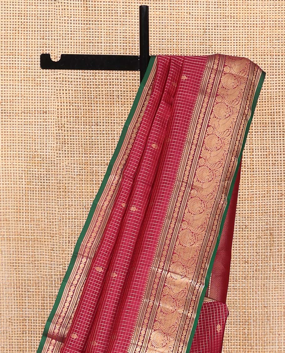 Reddish Pink Vasundhara Silk Saree, Majestically Detailed with Zari Buttas and Micro-Checks on Its Body, Highlighted by Zari Border of Rekku, Muthu, Banaras, Rudraksham, and Mayil Designs, Diagonally Striped Pallu, and Paired with a Contrast Blouse