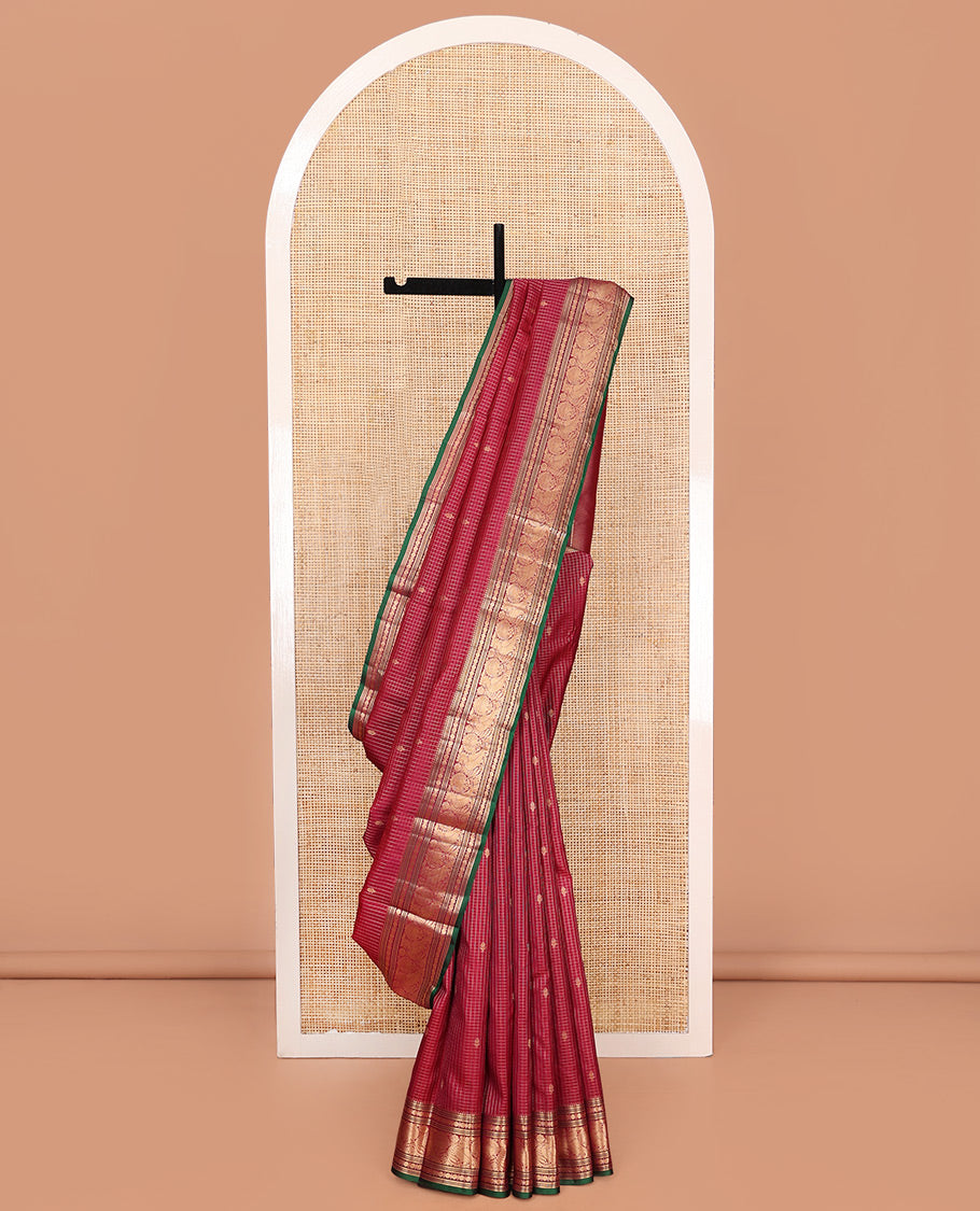 Reddish Pink Vasundhara Silk Saree, Majestically Detailed with Zari Buttas and Micro-Checks on Its Body, Highlighted by Zari Border of Rekku, Muthu, Banaras, Rudraksham, and Mayil Designs, Diagonally Striped Pallu, and Paired with a Contrast Blouse