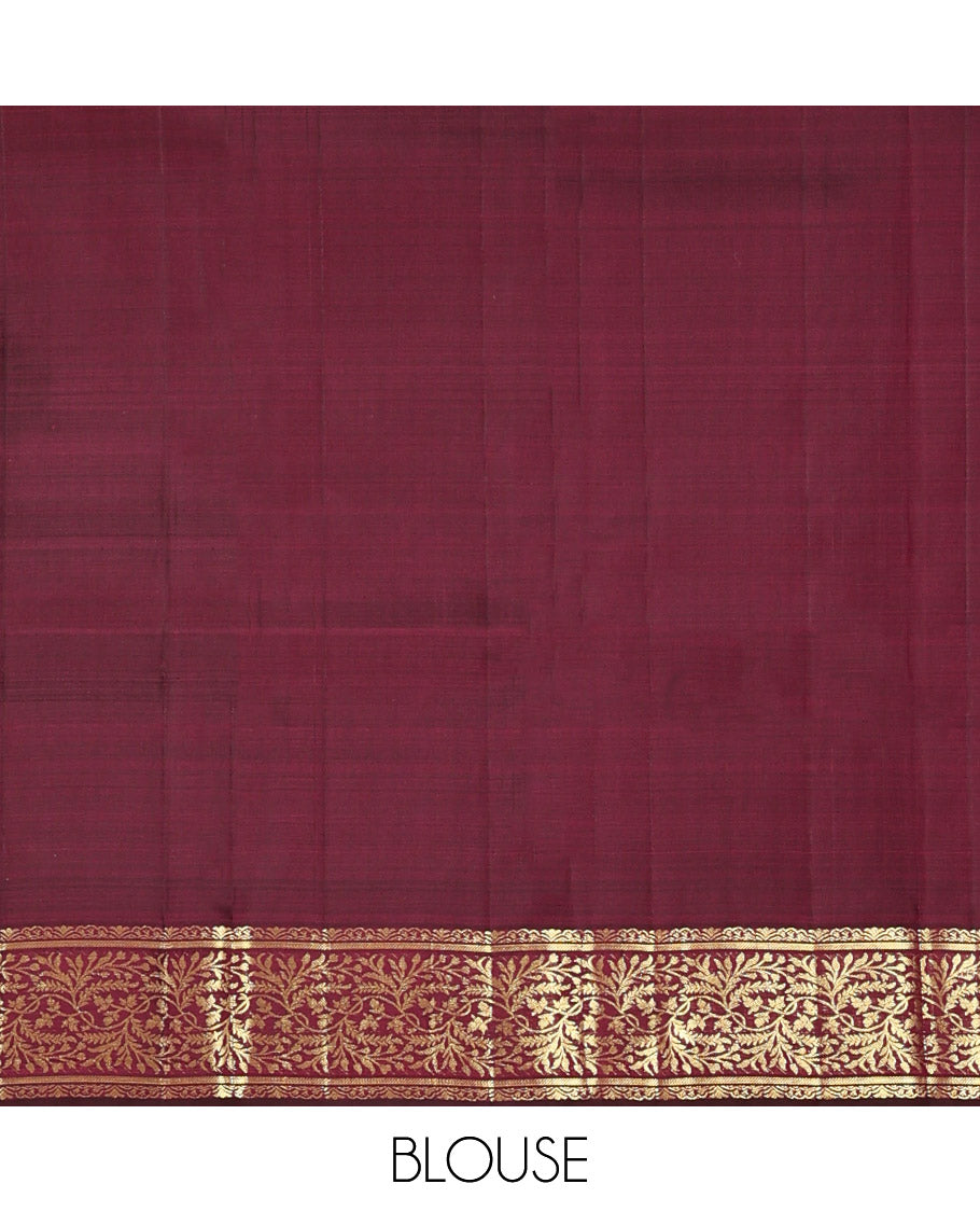 Wine Kanchipuram Silk Saree, Embellished with Zari Buttas on Its Body, Highlighted by a Zari Border of Floral Designs, Pallu of Jaal Designs, and Paired with a Matching Blouse