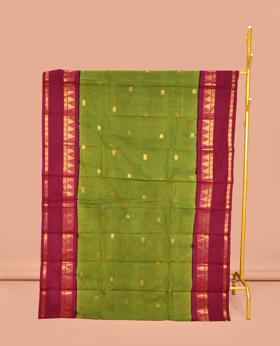 Parrot Green Sungudi Cotton Saree, Ornamented with Zari Buttas on Its Body, Complemented by a Contrast Retttai Pettu Traditional Zari Design Border, Zari-Design Pallu, and Paired with a Contrast Blouse