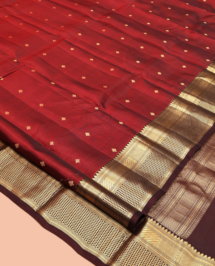 Red Vasundhara Lite Silk Mix Saree, Bedecked with Zari Buttas, a Contrast Border of Thilakam Mokku, Mayil Kann, and Ara Maadam, Grand Pallu, and a Contrast Blouse
