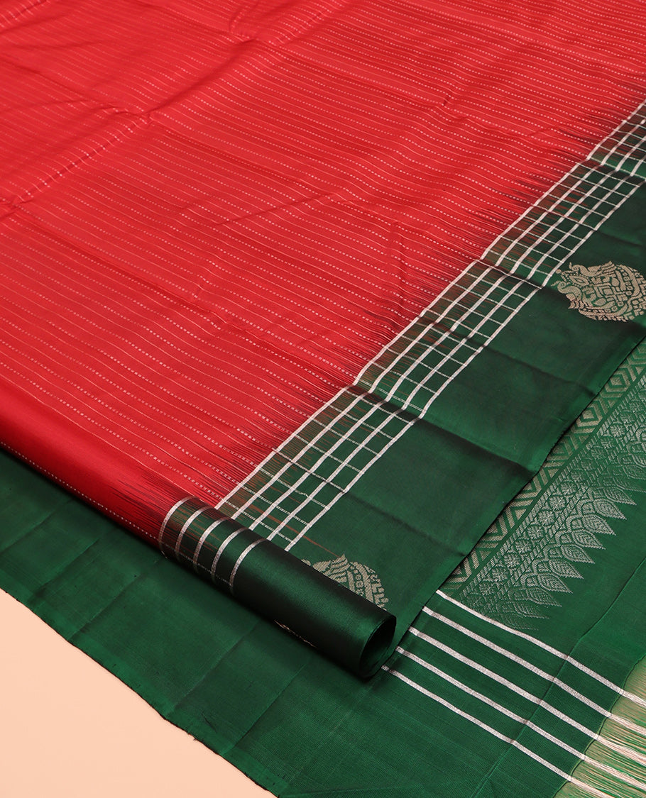 Red Kanchipuram Silk Saree, Subtly Sparkled with Stripes, a Contrast Checked Border of Peacock Buttas, Grand Jaal Pallu, and a Contrast Blouse