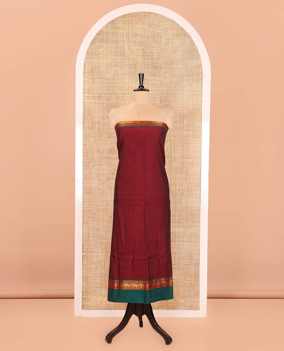 Maroon Plain Mercerised Cotton Material Churidar Set, Complemented by Contrast Elephant Motifs Woven Zari Border, Comes with a Plain Mercerised Cotton Bottom, and Is Paired with a Matching Mercerised Cotton Dupatta Mirroring the Same Design