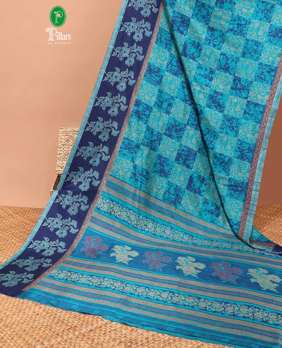 Blue discharge print crackle silk saree with contrast border & discharge negetive print blouse