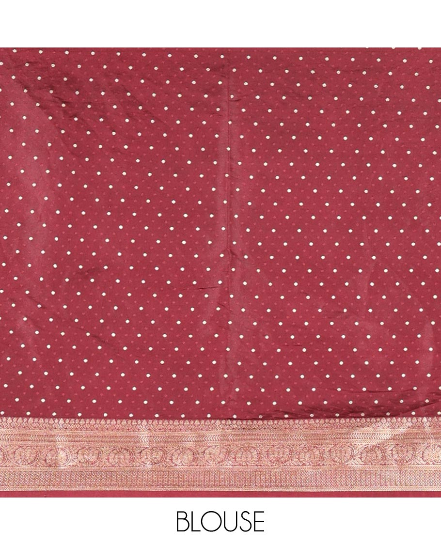 Wine Semi-Banaras Satin Silk Saree, Prettified with Floral Zari Buttas Across Its Body, Highlighted by Traditional Zari Design Border, Grand Zari Woven Palu of Jaal Designs, and Paired with a Matching Blouse