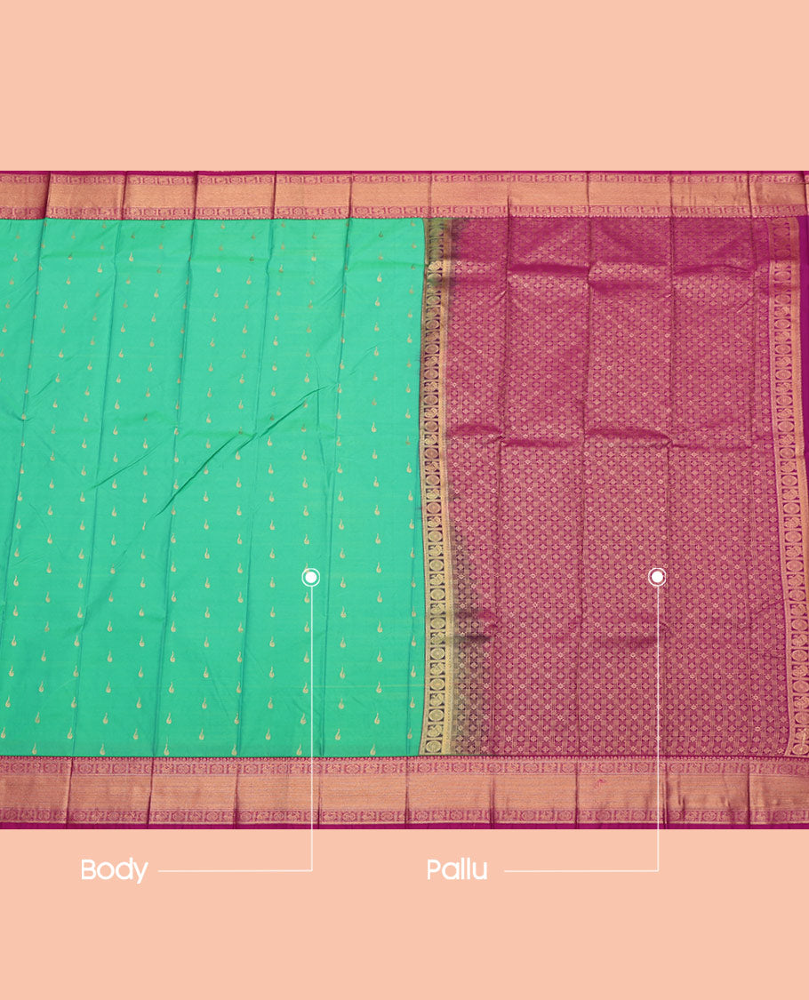 Green Budget Silk Saree, Sparsely Woven with Zari Buttas All Over Its Body, Complemented by a Contrast Traditional Zari Design Peacock-Chakram Border, Grand Pallu, and Paired with a Contrast Blouse