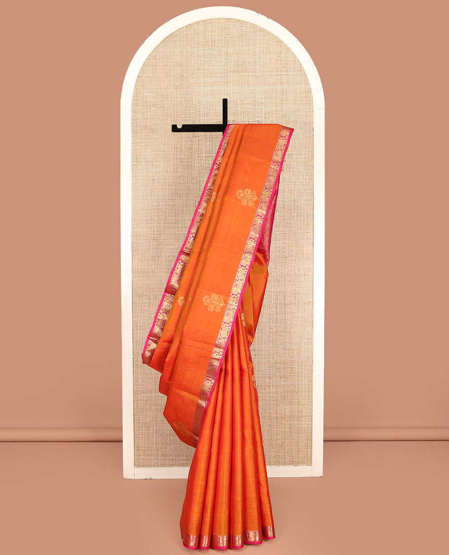 Orange Kanchipuram Silk Saree, Accentuated with Zari Buttas All Over Its Body, Complemented by Contrast Border of Yaanai and Mayil Designs, Grand Floral Jaal Pallu, and Paired with a Contrast Blouse