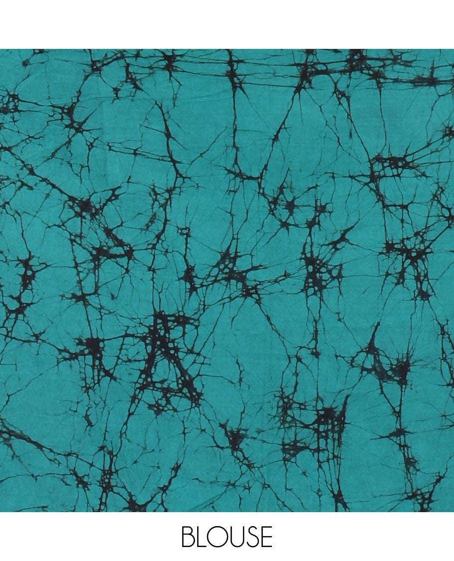 Black checked batik printed mul cotton saree, contrast kaleidoscope colored batik printed pallu, and a contrast batik printed blouse