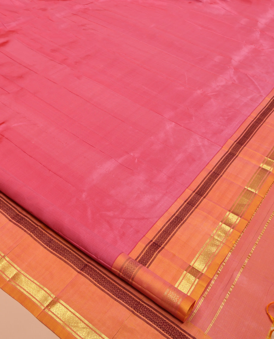 Pink Plain Kanchipuram Silk Saree, Complemented by a Contrast One-Sided Rettai Pettu Mayil Kann Border, Zari Striped Pallu, and No Blouse