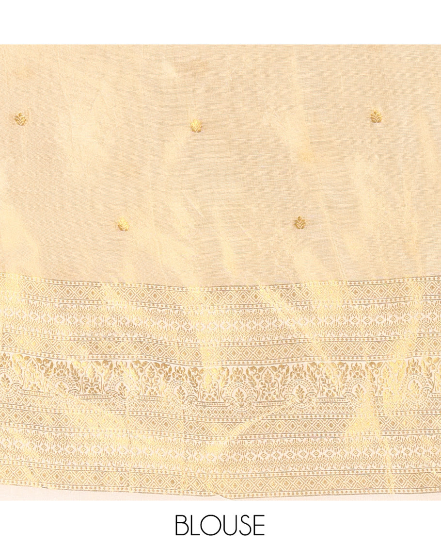 Cream Gold Tissue Half-Saree, Zari Buttas on Its Skirt, a Matching Blouse, an Intricately Zari-Designed Dhavani