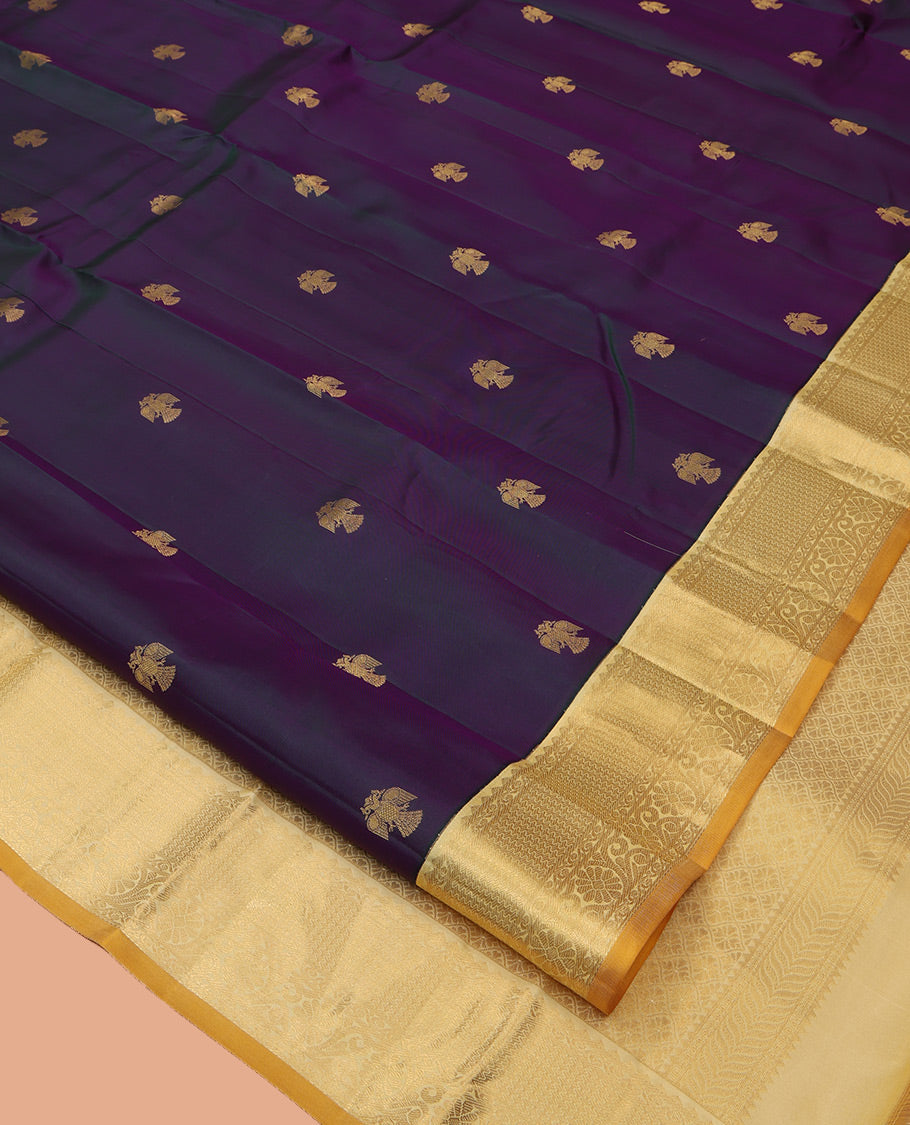 Purple Vasundhara Silk Saree, Elevated with Iruthakshi Buttas All Over Its Body, Complemented by a Contrast Border of Rekku, Then Kuli Kann, and Kodi Visiry Designs, Grand Jaal Pallu, and Paired with a Contrast Blouse