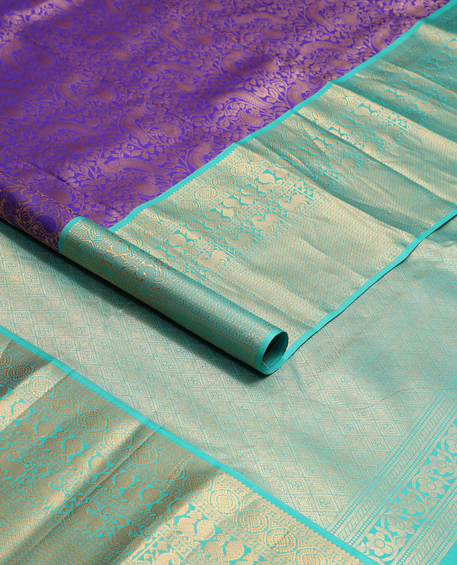 Purple jaal design kancheepuram silk saree with contrast border of rekku, muthu, poo chakram mayil design & zari design pallu